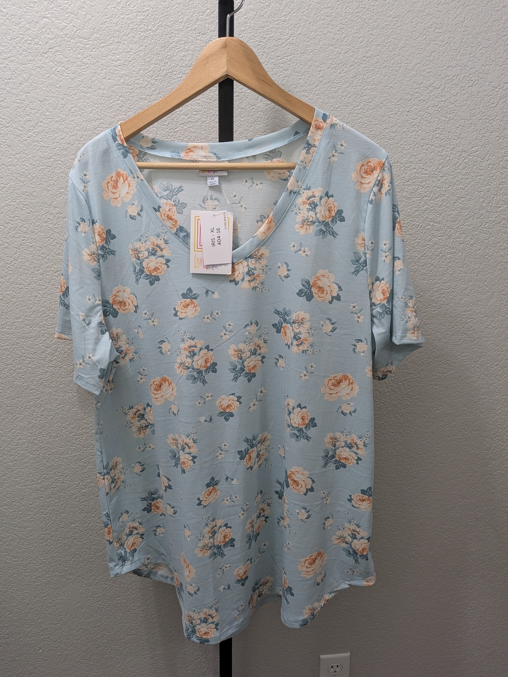 LuLaRoe Light Blue V-Neck Short Sleeve Top with Peach Floral Pattern